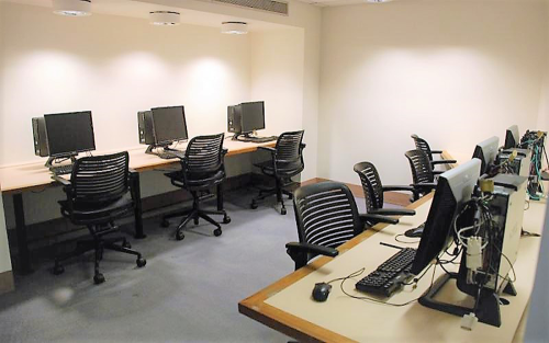A computer lab with six workstations visible