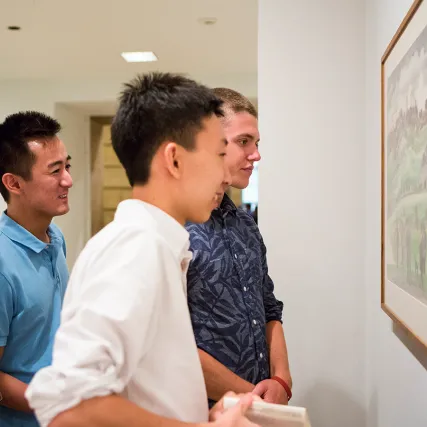 Students look at a painting at the Philadelphia Museum of Art