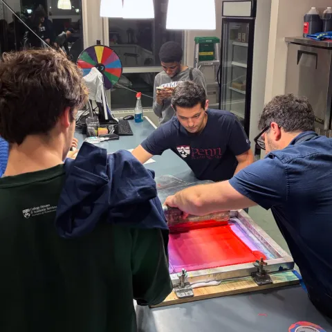 Harrison students silkscreen T-shirts with House Fellow Matt Neff