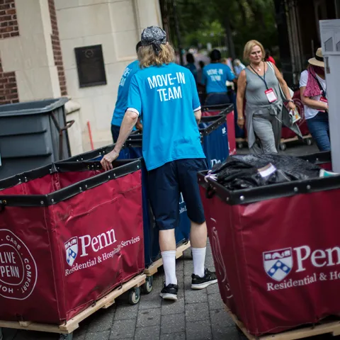 Penn Move-in assistants help students bring their stuff into the Houses