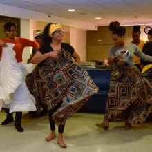 Two Du Bois residents learn a dance presented by a dancer from an Afro-Caribbean instructor