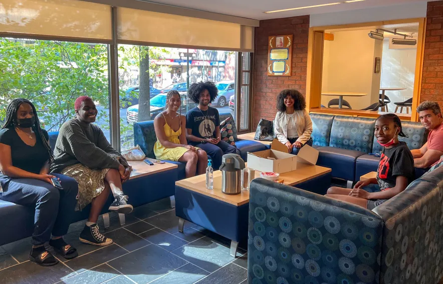 Du Bois residents and faculty sit in the Multipurpose Room at Du Bois