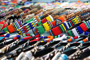 South African beaded jewelry on a display table at a market