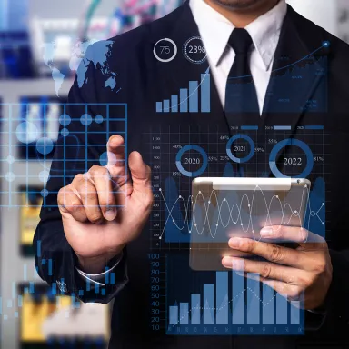A business man in a business suit holding a business tablet and tapping on digital business images. Business.